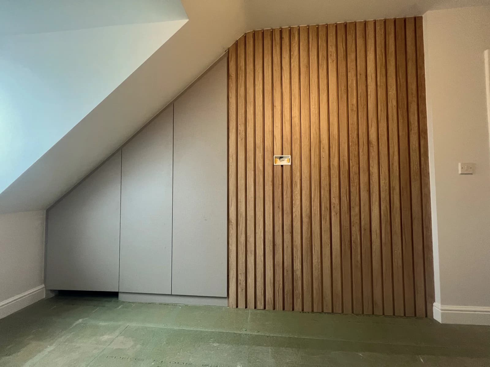 Sloped Ceiling Built-In Wardrobe with Oak Cladding